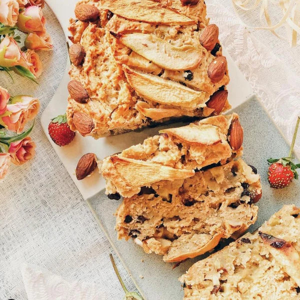 A loaf of bread topped with fresh strawberries