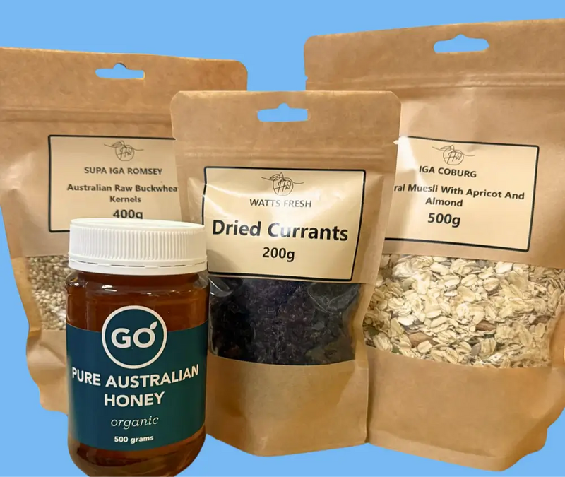 Bags of Australian raw buckwheat, dried currants, natural muesli, and a jar of organic pure Australian honey